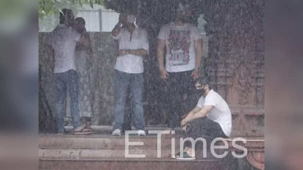 Asim Riaz sitting on the crematorium stairs