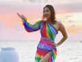 Glamorous pictures of Sunny Leone in a colourful thigh-high slit beachwear will make your heart skip a beat!