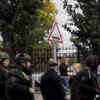 Article image for: <i class="tbold">law enforcement</i> officers work near the scene of a shooting at university in Perm