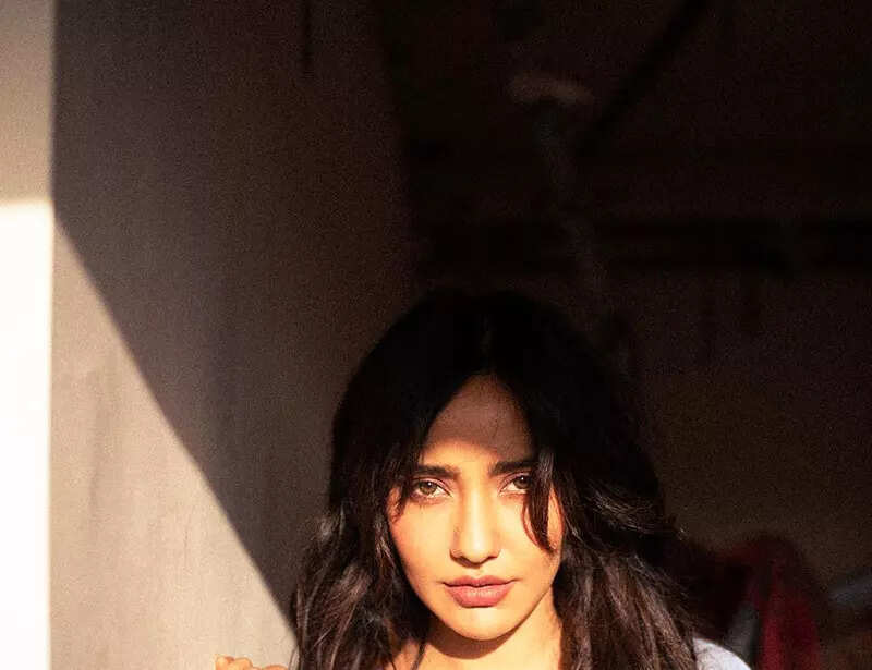 Neha Sharma oozes oomph in a blue bralette and an unbuttoned shirt in these new drool-worthy pictures