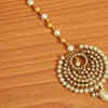 ​Pearl studded gold Maang tikka and nose rings