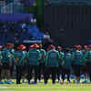 Game plans? Afghanistan's team members stand in a huddle before the start