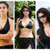​Side parted hair, sleek high pony hair, and dramatic sunglasses and bodycon dress