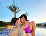 Bikini-clad Kourtney Kardashian shares a passionate kiss with fianc&eacute; Travis Barker in the pool