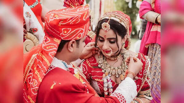 Their bright red wedding look