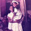 Holding her brother Vijay