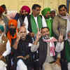 Farmer leaders show victory sign