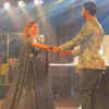 Hand-in-hand on stage