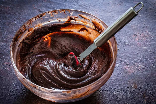 mixing-bowl-filled-with-homemade-chocolate-dough-picture-id1130692249