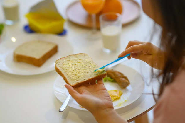 asian-chinese-female-sister-having-breakfast-at-dining-room-near-picture-id1144808503