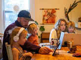 These pictures show how parents and children manage work and online school from home
