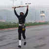 A Navy person runs