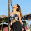 Article image for: These breathtaking pictures of Mouni Roy in an off-shoulder crop top and short skirt will make you crave for seaside vacation