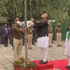 Defence minister Rajnath Singh unfurls the national flag at his residence on the occasion of Republic Day