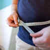 Why does one gain weight during mid-age?