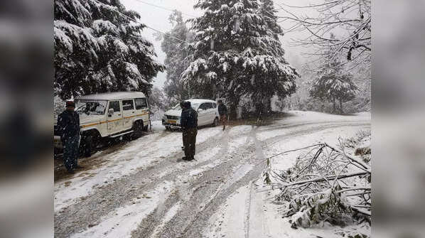Poll officials brave harsh weather to reach booths