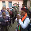 CM and BJP candidate from Khatima, Pushkar Singh Dhami arrives at a polling booth in the constituency.
