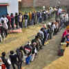 Voters wait to cast their vote at a polling booth, during the second phase of Uttar Pradesh assembly elections, in Moradabad.