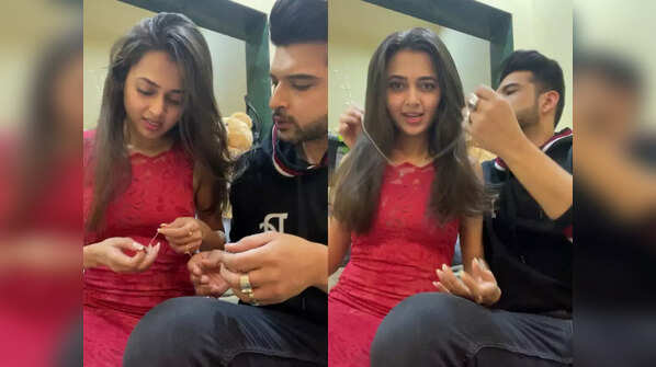 Karan helps Tejasswi with her necklace