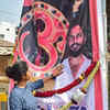 Ashwini , sister of slain Bajrang dal activist Harsha, touches a garlanded photo of her brother hung outside their residence, as section 144 was imposed amid tension in the town over his murder, in Shivamogga. (PTI photo)