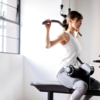 Behind the lat pull downs