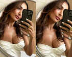 Malaika Arora sets hearts racing with her new mirror selfies in satin slip thigh-high dress