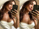Malaika Arora sets hearts racing with her new mirror selfies in satin slip thigh-high dress