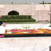 UK PM Boris Johnson lays wreath at Raj Ghat and pays tribute to Mahatma Gandhi. (ANI photo)