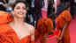 Cannes red carpet: Deepika Padukone stuns in an orange gown but struggles to walk and climb stairs