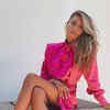 Article image for: The model, actress and TV presenter wowed in this bright pink shirt dress while keeping her blonde locks open.