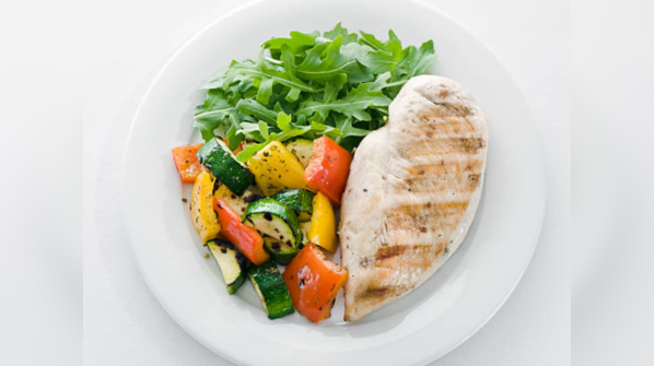 How to prevent microbial hazards associated with raw meat?
