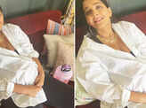 Soon-to-be mommy Sonam Kapoor flaunts her baby bump in an oversized white shirt in these new pictures