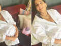 Soon-to-be mommy Sonam Kapoor flaunts her baby bump in an oversized white shirt in these new pictures