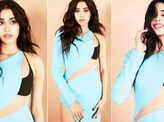Janhvi Kapoor flaunts her toned midriff in a blue slit dress in these captivating pictures