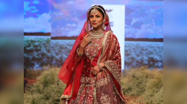 Shehnaaz Gill turns bride in a stunning red lehenga for her debut walk at Times Fashion Week