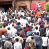 Supporters of rebel Shiv Sena MLA Eknath Shinde gather outside his residence in Thane