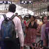 Mumbai: Due to heavy rainfall while several tracks had been inundated, trains were delayed but didn't stop. Crowds throng stations as movement continues (ANI)
