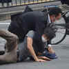 Suspect is tackled to the ground by police at Yamato Saidaiji Station in the city of Nara after the attack on former Japan PM Shinzo Abe.