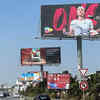 Vehicles drive past a billboard depicting Ons Jabeur in Tunis, Tunisia.