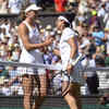 Kazakhstan's Elena Rybakina (L) and Tunisia's Ons Jabeur shake hands after the women's singles final.