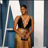 Article image for: Everyone wants to have their moment on the Vanity Fair carpet and so did she in plunging black and gold gown.