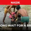 Article image for: Maharashtra: No bridge, children cross river in <i class="tbold">utensils</i>