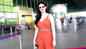 Amyra Dastur sizzles in rust orange jumpsuit, completes her look with stylish shades and a bag