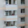 Residents on video call with  friends and family pointing out towards the Twin Towers