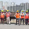 Sanitation worker on stand-by near the demolition site