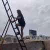 'Whatever it takes', a resident climbs up in order to have a clear view of demolition