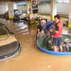 Cars and bikes submerged in the rain water in a flooded basement of S S Felicity apartment. Lunch was supplied to the stranded residents using a plastic raft.