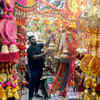 Article image for: Guwahati, Oct 19 (ANI): A shopper looks at decorations for upcoming Diwali festi...