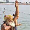 Kurukshetra: A devotee offers prayers to the sun as he prepares to take a holy dip during a Partial Solar Eclipse