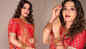 Monalisa looks beautiful as she poses in a red saree